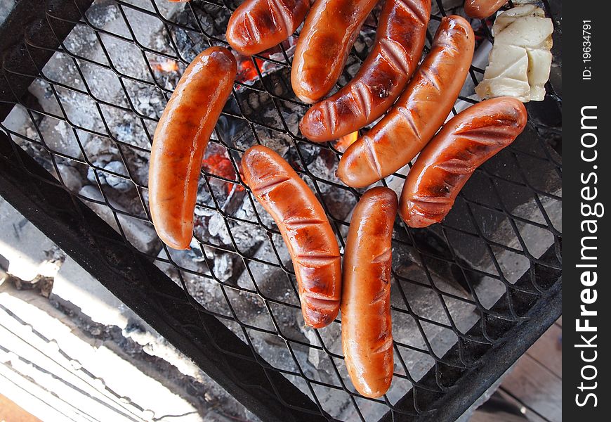 Grilling barbecue with sausages and cheese. Grilling barbecue with sausages and cheese