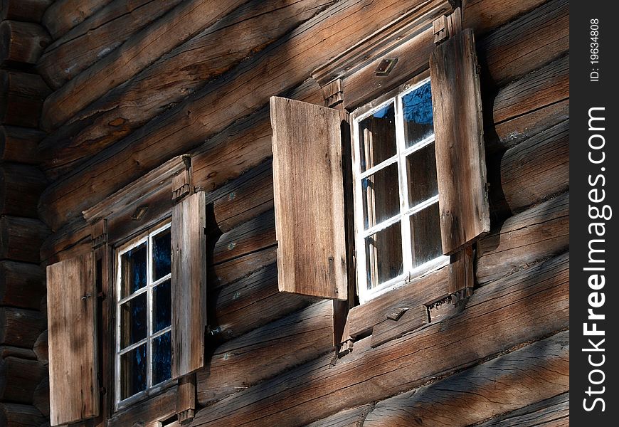 Wooden log house with windows. Wooden log house with windows