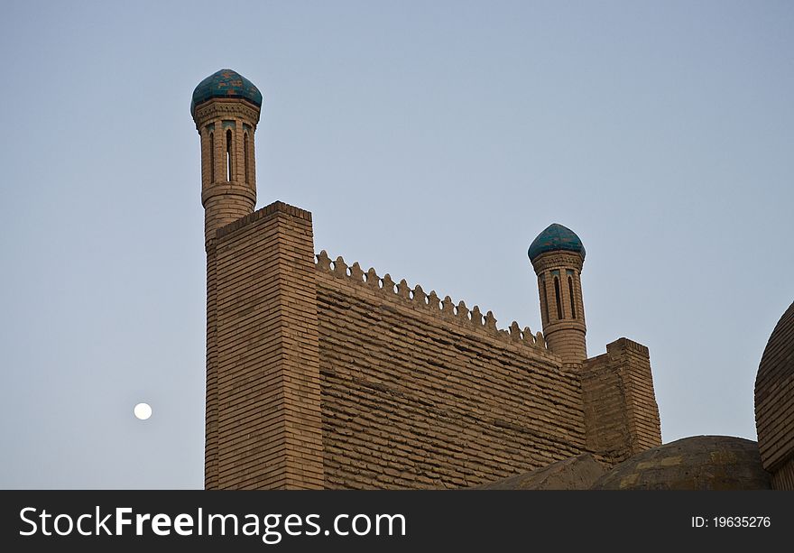 Mosque wall in Uzbekistan and moon on the background, taken in Bukhara. Mosque wall in Uzbekistan and moon on the background, taken in Bukhara