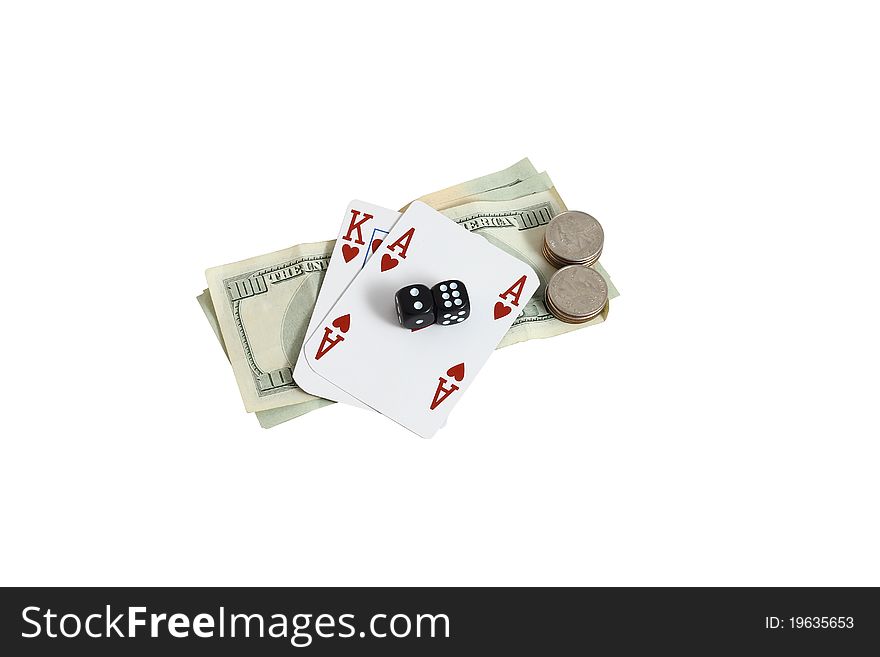 Cards and dice on top a pile of money. Isolated on a white background. Cards and dice on top a pile of money. Isolated on a white background.