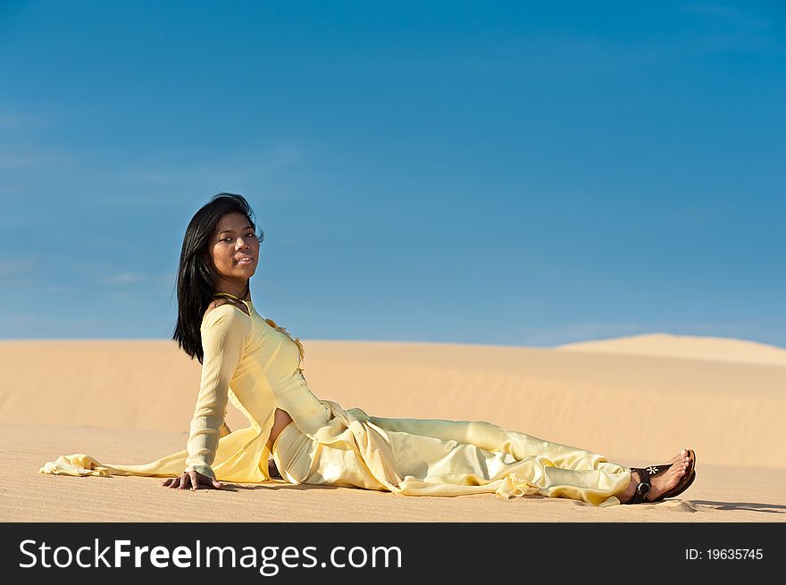 Joyous young woman in dunes