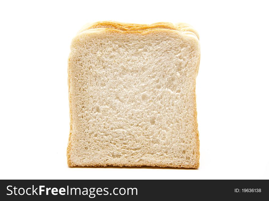 Cut white bread and onto white background