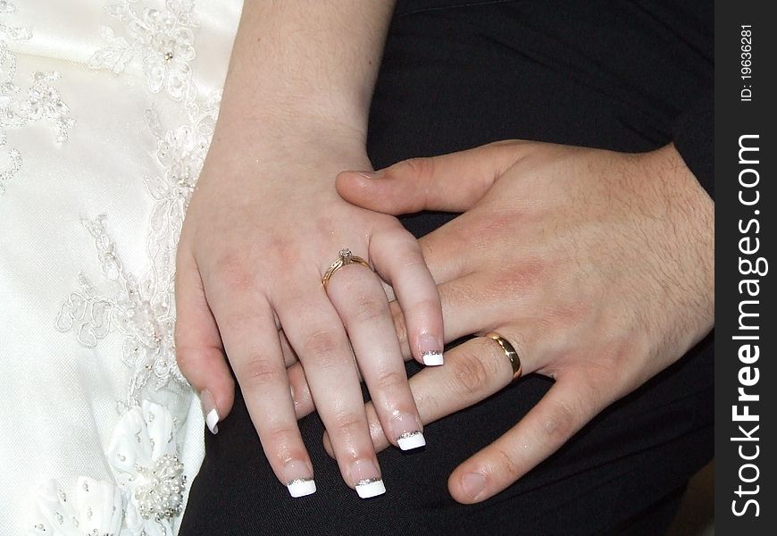 Newlywed couple hands and wedding rings close up. Newlywed couple hands and wedding rings close up