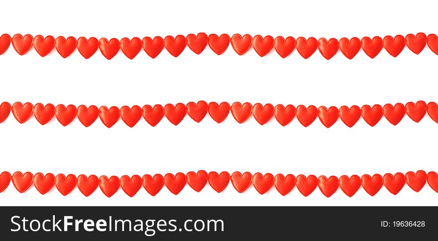 A continuous chain of red silk hearts can be used as a background. A continuous chain of red silk hearts can be used as a background