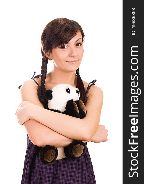 Portrait of a beautiful young woman hugging toy bear. Portrait of a beautiful young woman hugging toy bear