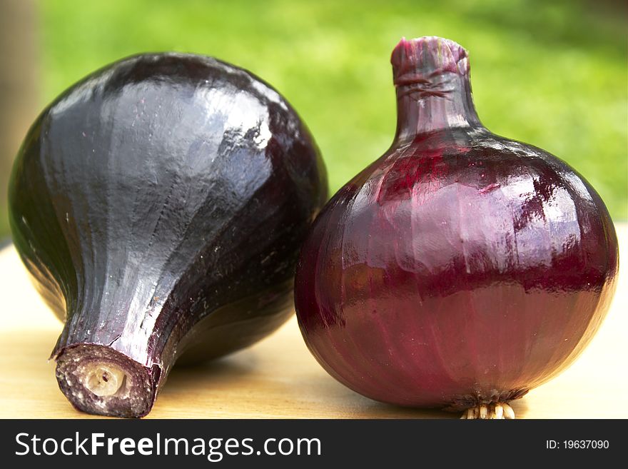 Two red onions on the table