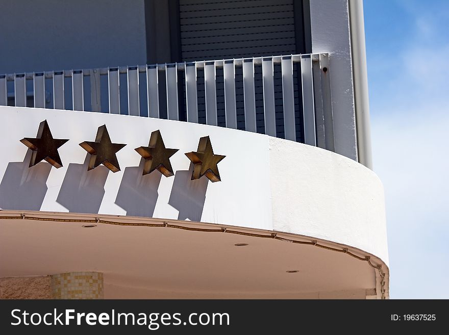 Four golden stars of a hotel. Four golden stars of a hotel