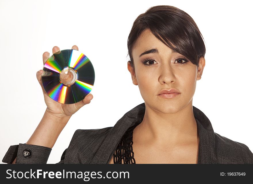 Gorgeous professional woman holding a CD-R to the camera with a serious expression. Gorgeous professional woman holding a CD-R to the camera with a serious expression.