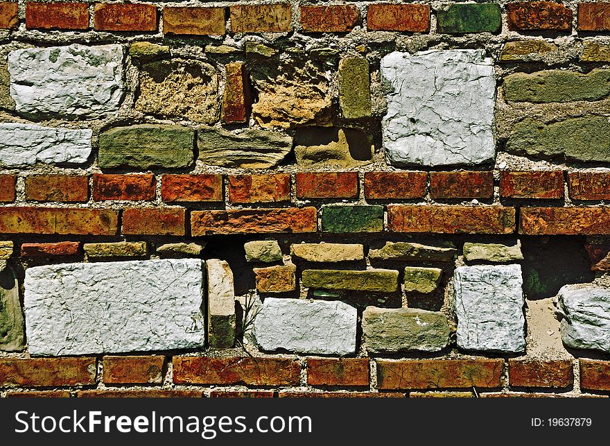 Colorful and different bricks forming an old wall. Colorful and different bricks forming an old wall