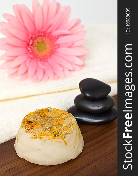 Natural handmade soap and pink flower and towel, masage stones. Natural handmade soap and pink flower and towel, masage stones.