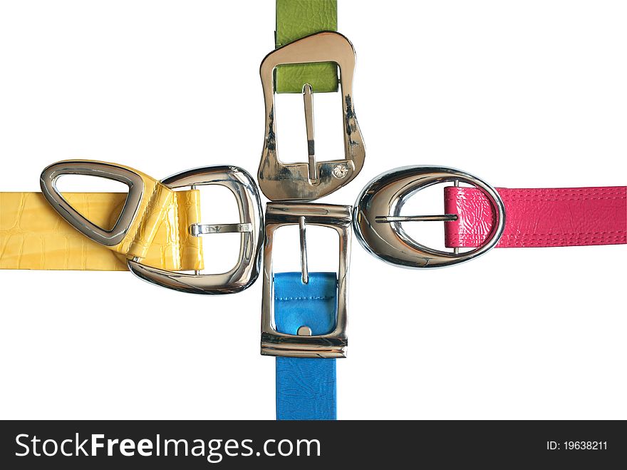 Four colored leather belts as cross on white background. Clipping path is included. Four colored leather belts as cross on white background. Clipping path is included