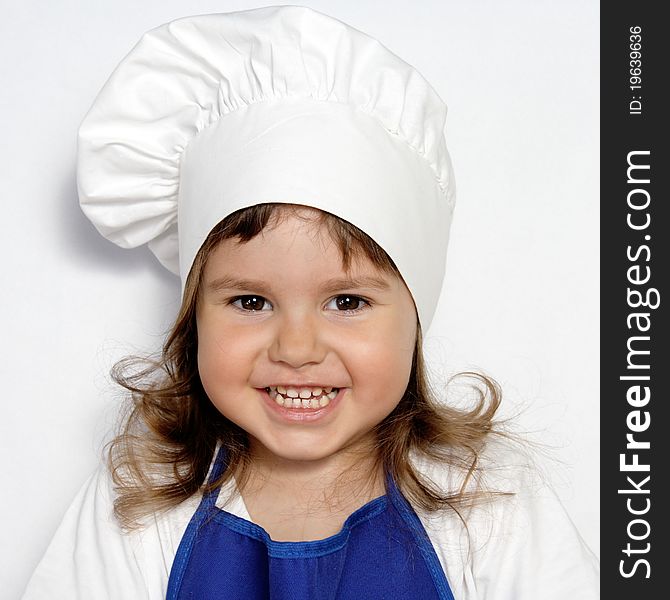 Little Cute Girl in Cook s Cap Portrait