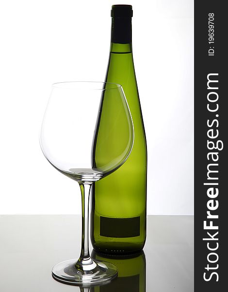 Glass and bottle of white wine. Glass and bottle of white wine