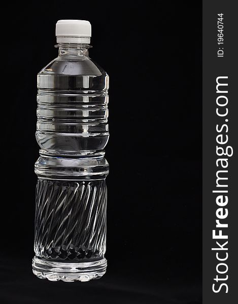 Clear water bottle black background