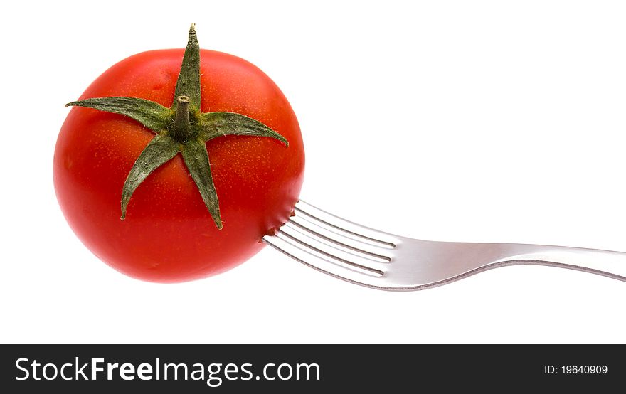 Red tomato on a plug isolated on the white