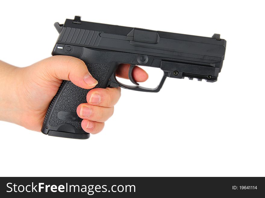 Hand holding a handgun. Close up on white background