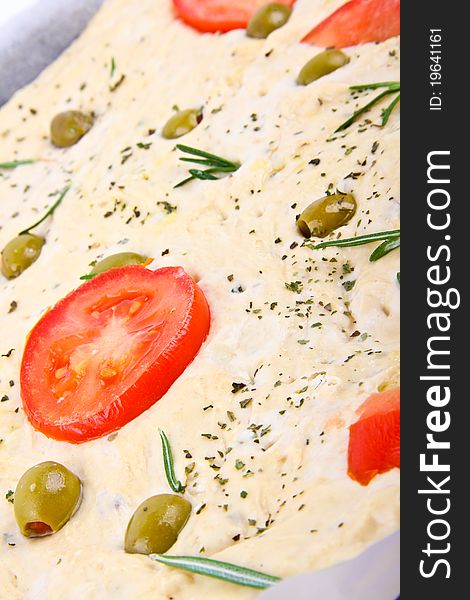 Italian bread, Close up. tomato and olive in the middle of picture