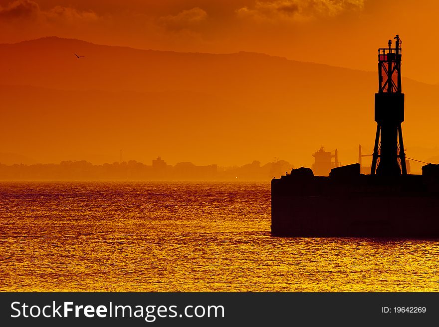 A golden sunset over the bay of Gibraltar taken from Gibraltar looking towards Spain. A golden sunset over the bay of Gibraltar taken from Gibraltar looking towards Spain.