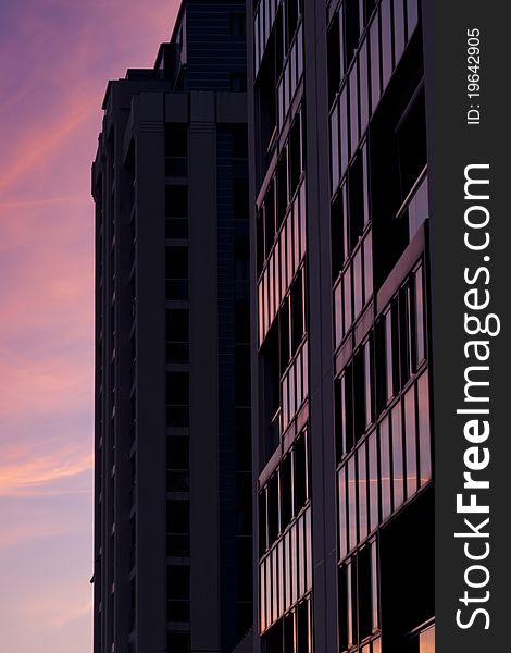 A building in Gibraltar reflecting the evening sunset off the glass panels. A building in Gibraltar reflecting the evening sunset off the glass panels.