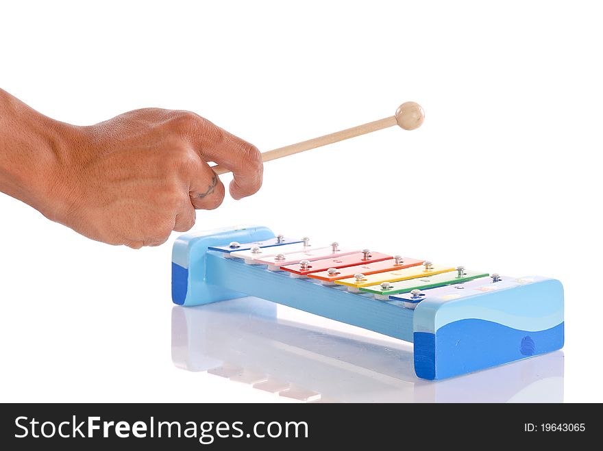 Male Hand Playing a Xylophone