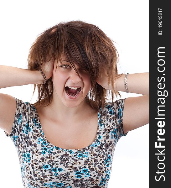 Angry woman is screaming out loud and pulling her hair.