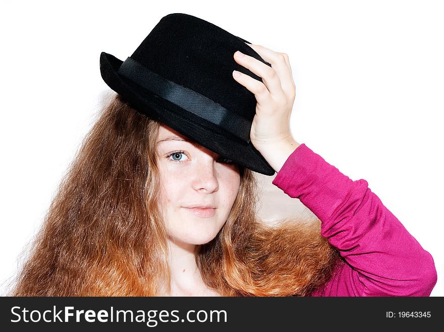 The girl with the black hat covering the half of the face, isolated on a white background. The girl with the black hat covering the half of the face, isolated on a white background.