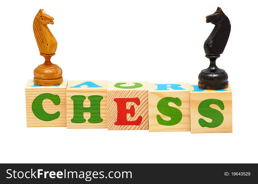 Alphabet wood blocks forming the word chess isolated on a white background. Alphabet wood blocks forming the word chess isolated on a white background