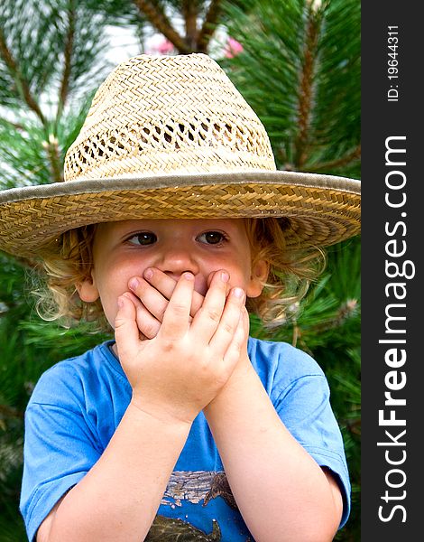 Sweet little boy in a big hat