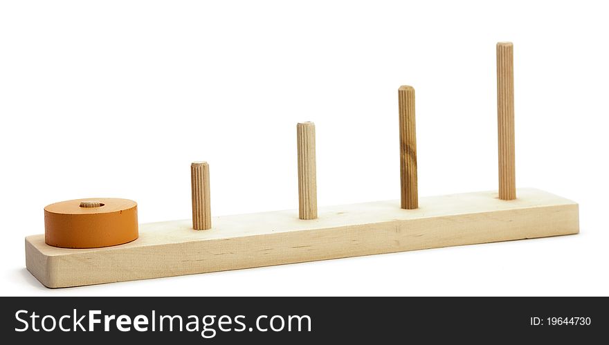 Wooden colored logical toy on white