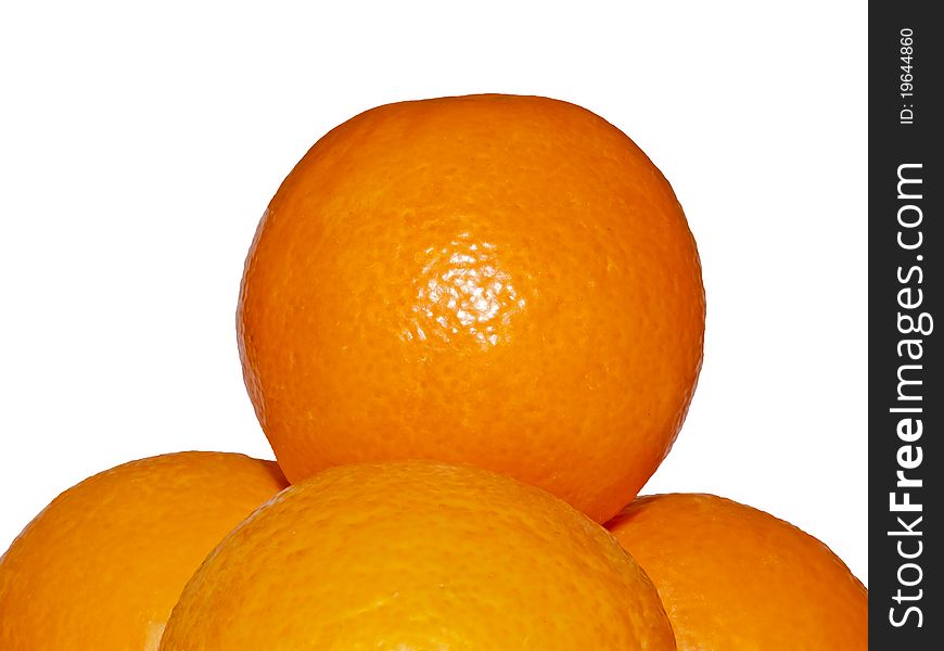 Four oranges stacked in a pyramid