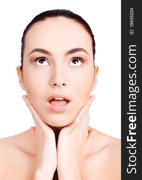 Portrait of a young woman open-mouthed with astonishment. Isolated over white background. Portrait of a young woman open-mouthed with astonishment. Isolated over white background.