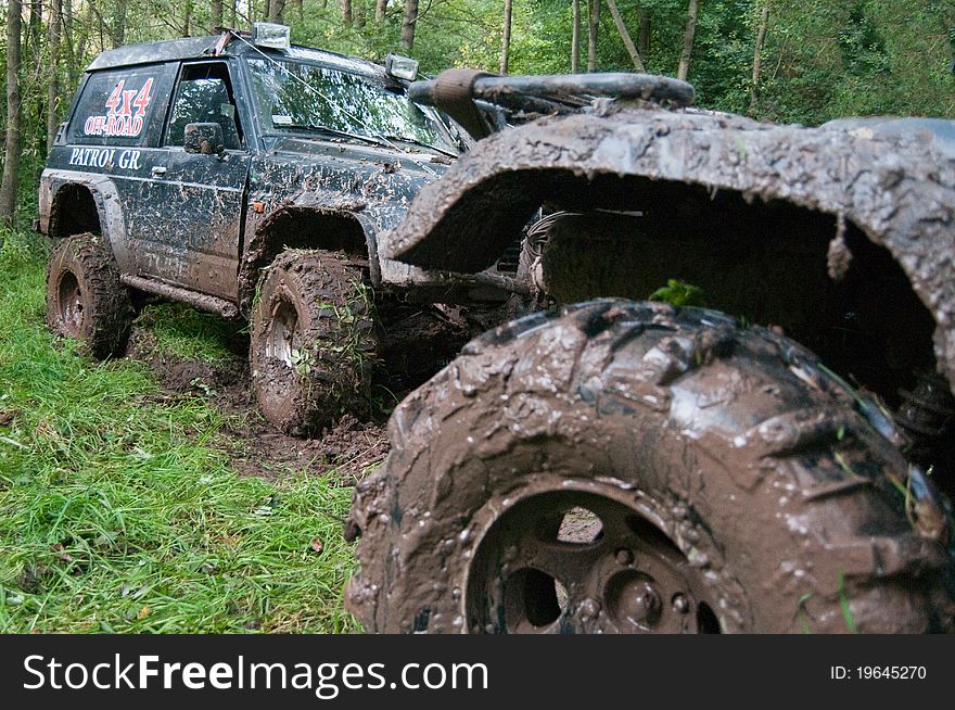 Off-road vehicles after the race. Sport cars.