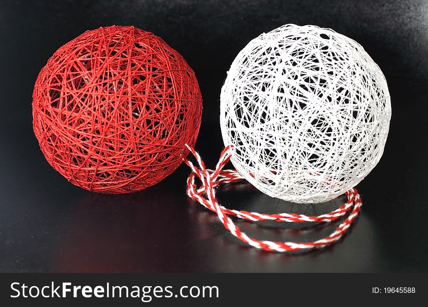 Red and white ball of yarn in the middle of the empty