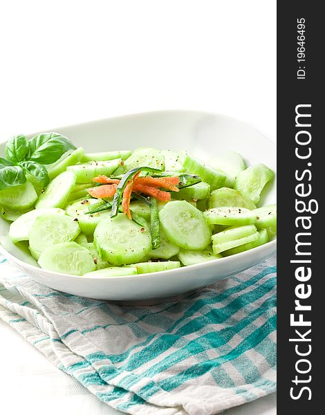 Photo of delicious cucumber salad on green white napkin