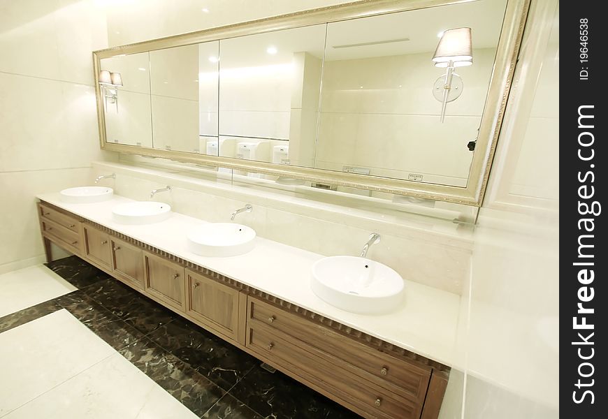 Faucet and washbasin in men lavatory