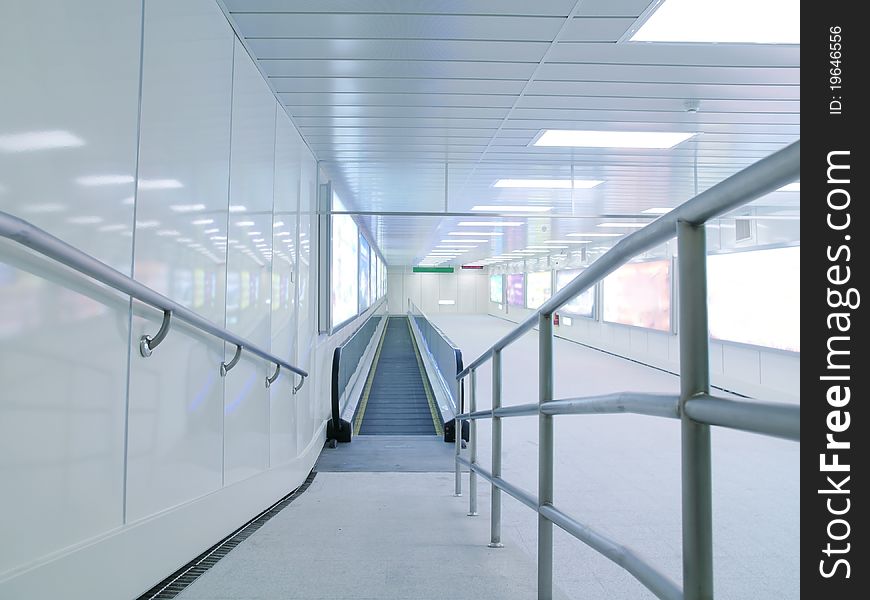Long corridor with escalator in underground passage. Long corridor with escalator in underground passage