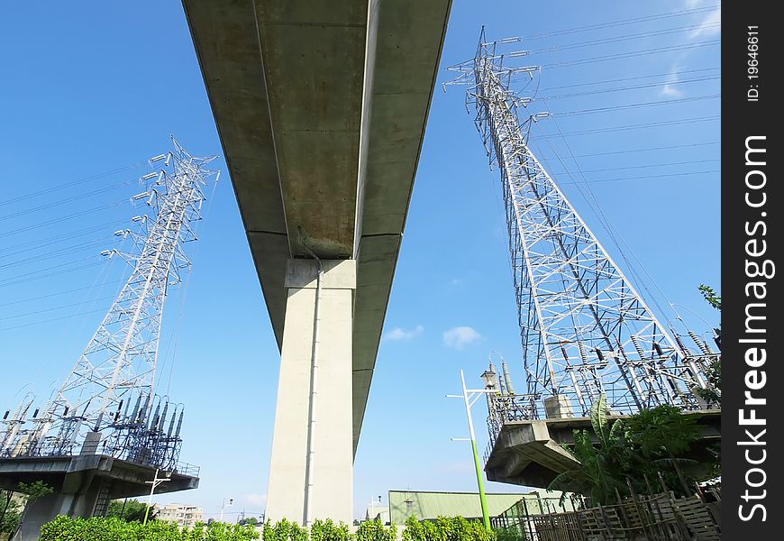 Electric towers near viaduct of high speed train. Electric towers near viaduct of high speed train