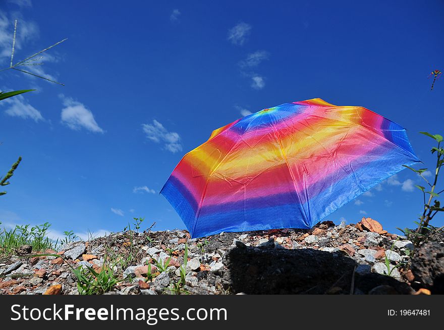 Colorful umbrella in the countryside