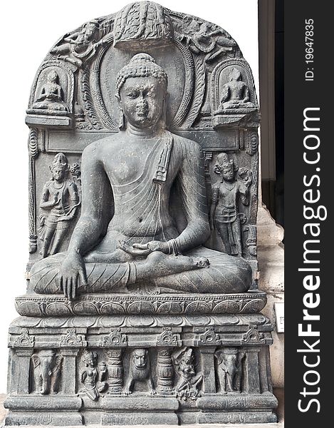 Ancient stone sculpture of Buddha in meditation belonging to 11th century found in Java on display in the Indian Museum in Kolkata, India. Ancient stone sculpture of Buddha in meditation belonging to 11th century found in Java on display in the Indian Museum in Kolkata, India