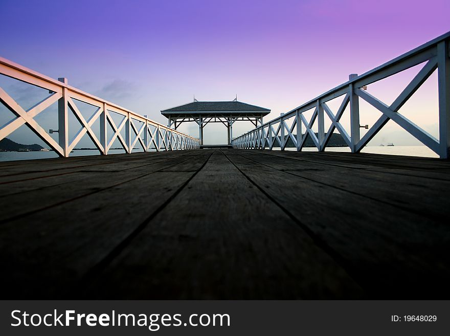 White wood bridge is along in the sea. White wood bridge is along in the sea