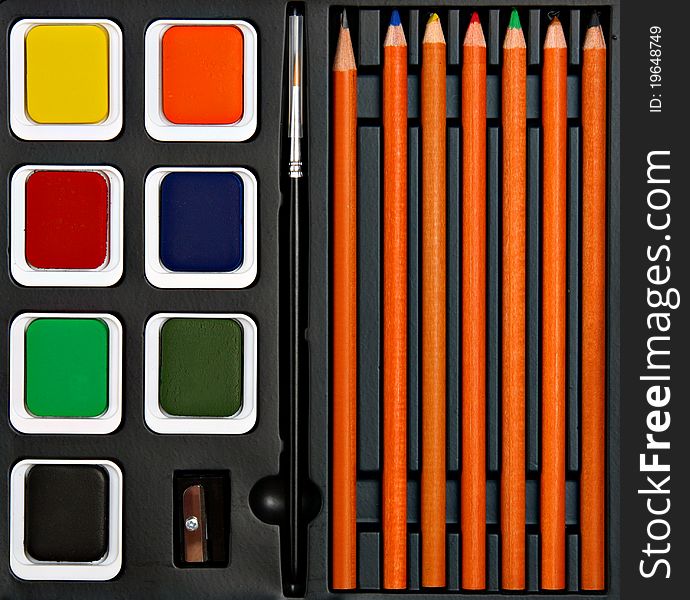 Set with aqarell colors, pencils and sharpener. Set with aqarell colors, pencils and sharpener