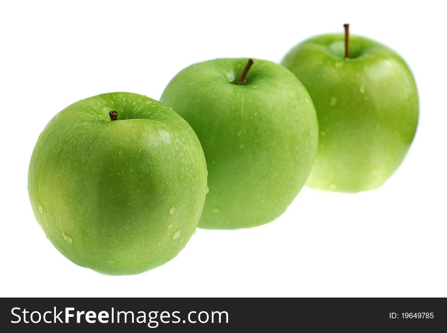 Three green apples isolated on white background.