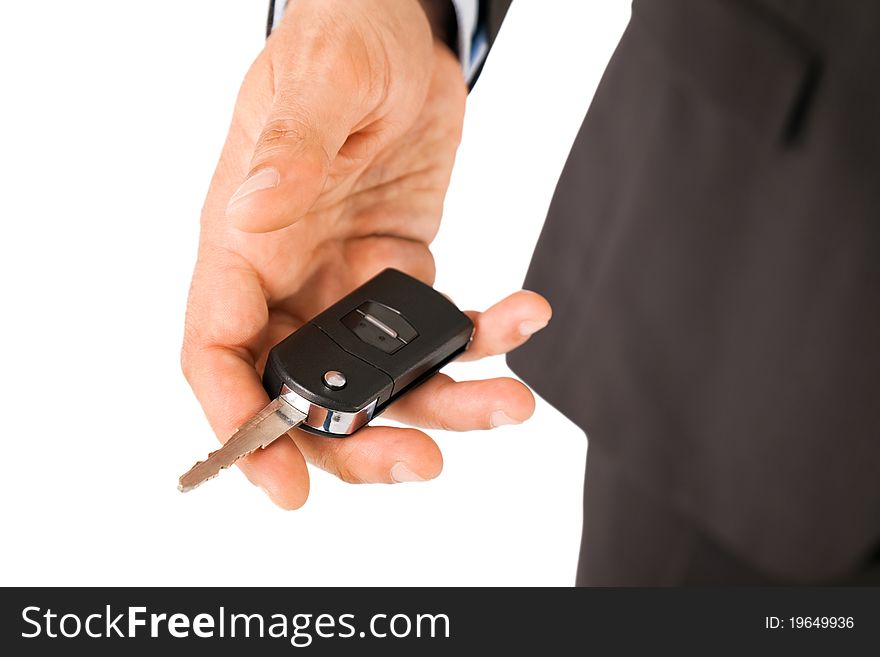 Close-up of male hand holding car key. Close-up of male hand holding car key