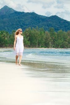 Woman Walks On A Beach Stock Photography Woman Walks On A Beach Stock Photography