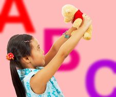 Girl Holding Her Teddy Bear Up In The Air Royalty Free Stock Images Girl Holding Her Teddy Bear Up In The Air Royalty Free Stock Images