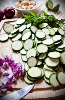 Food Preparation: Courgettes And Onions On A Board Stock Photo Food Preparation: Courgettes And Onions On A Board Stock Photo