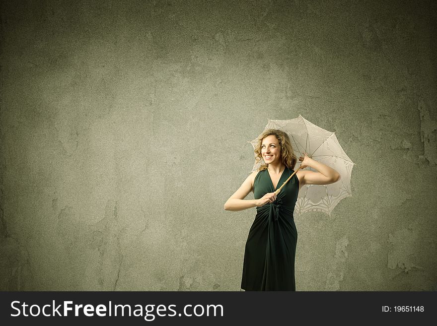 Beautiful smiling woman holding an umbrella