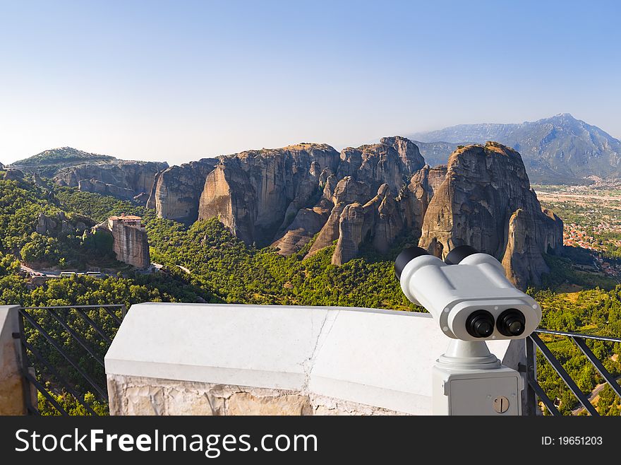 Binoculars and Meteora monastery in Greece