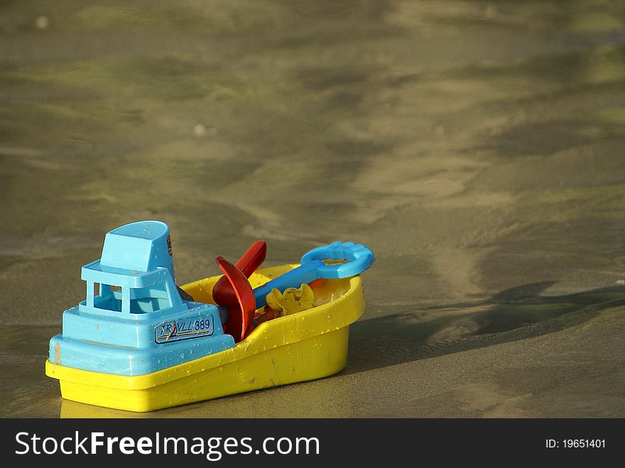 This is a little boat toy in the nice beach.