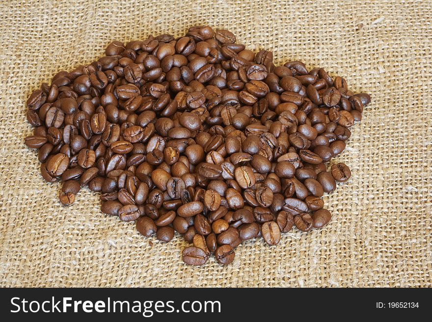 It is a lot of coffee grains lay on a fabric